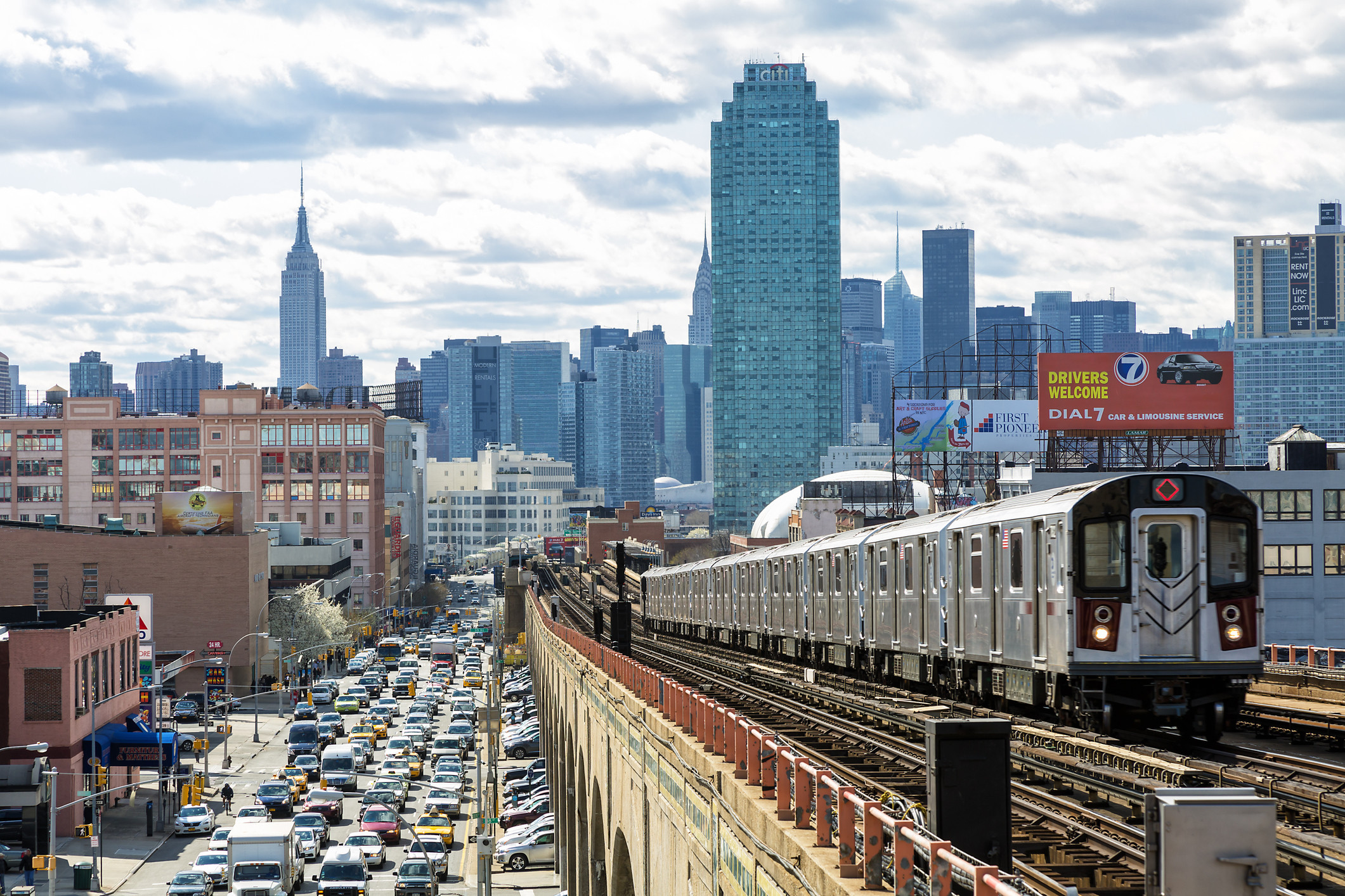 Subway Train Approaching Elevated Subway Station in Queens, New York